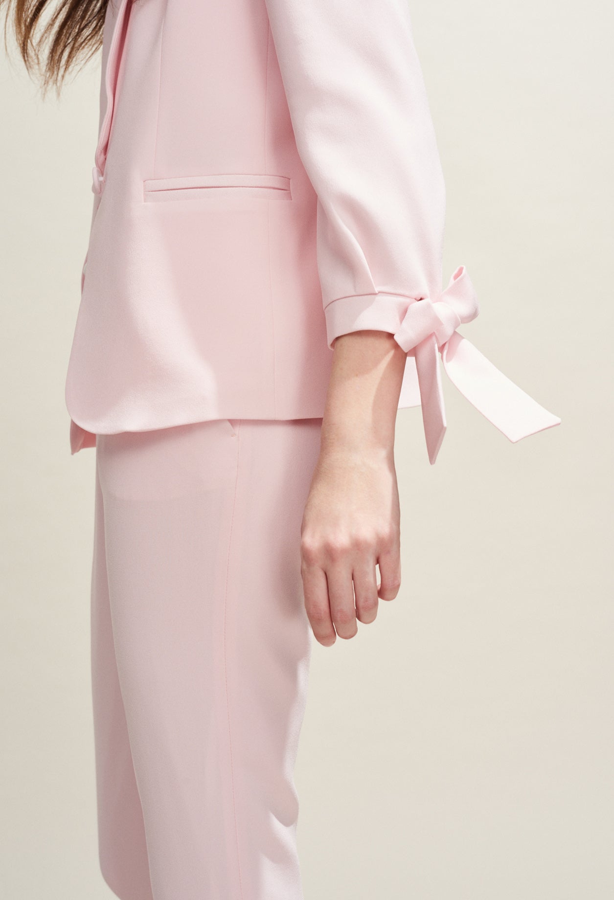 Veste tailleur rose pâle détails nœuds Faume - seconde main